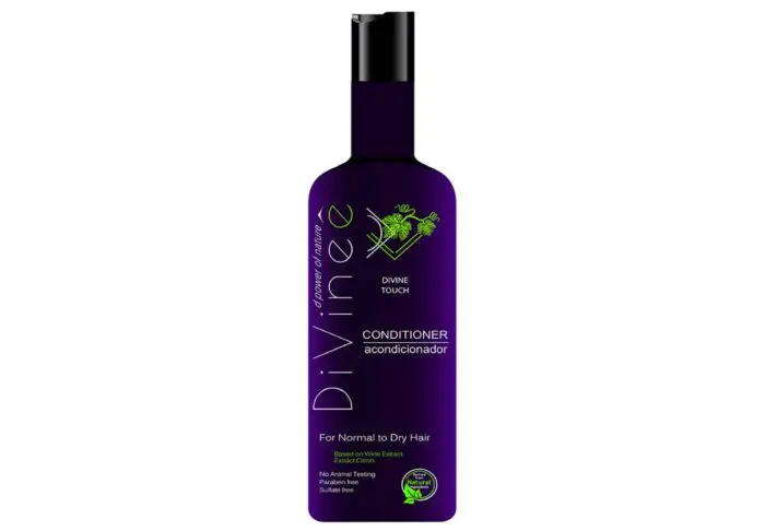 A bottle of conditioner for hair with purple label.