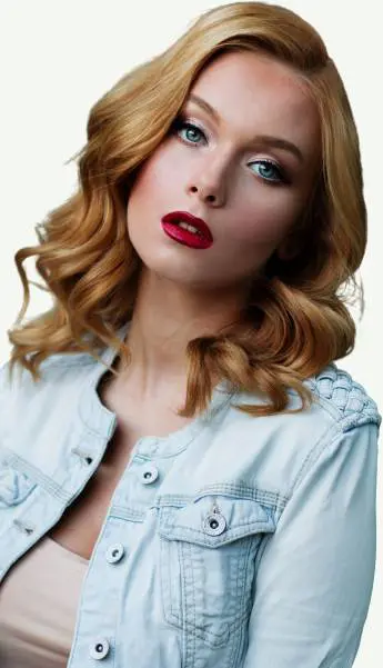 A woman with red lipstick and blonde hair.